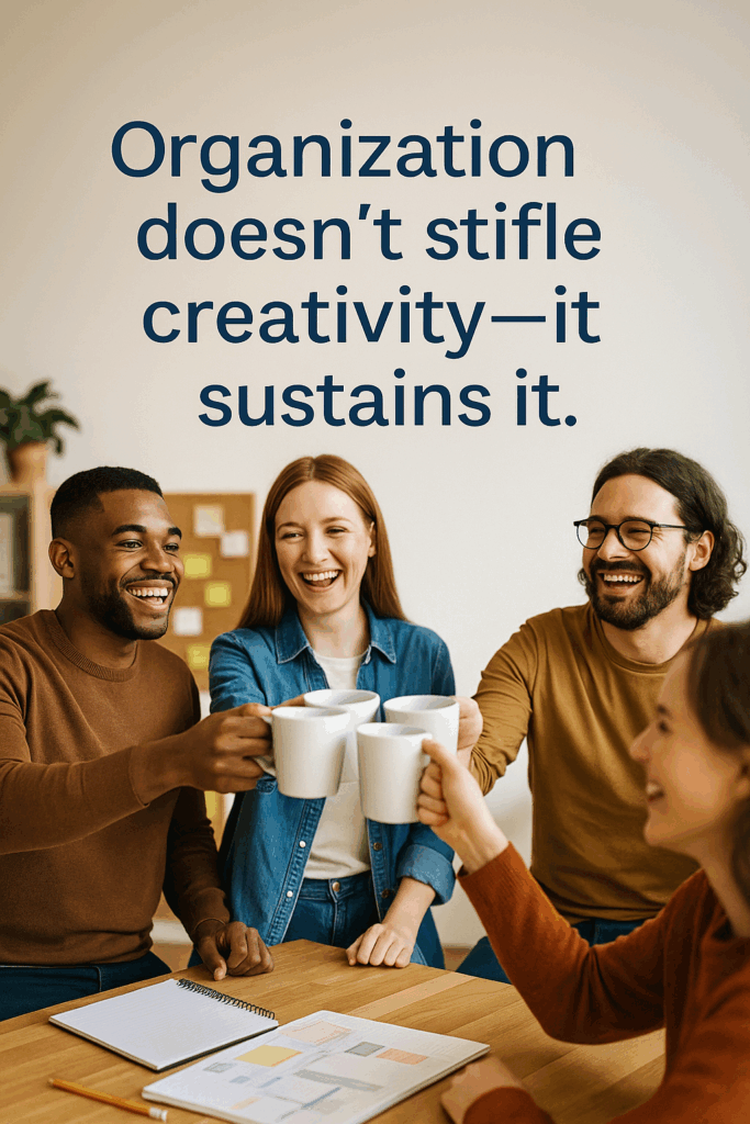 Inspirational photo of small business team celebrating marketing success with quote overlay, symbolizing the balance between structure and creativity.